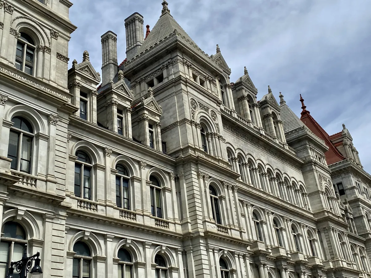 Ornate stone windows, towers and roofline on the south facade of the New York State Capitol in Albany