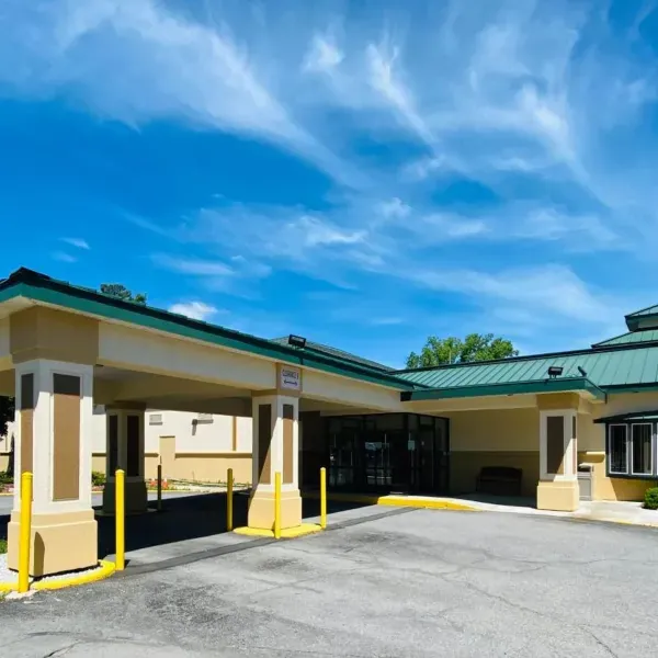 Covered entrance and exterior of Baymont by Wyndham Latham Albany Airport